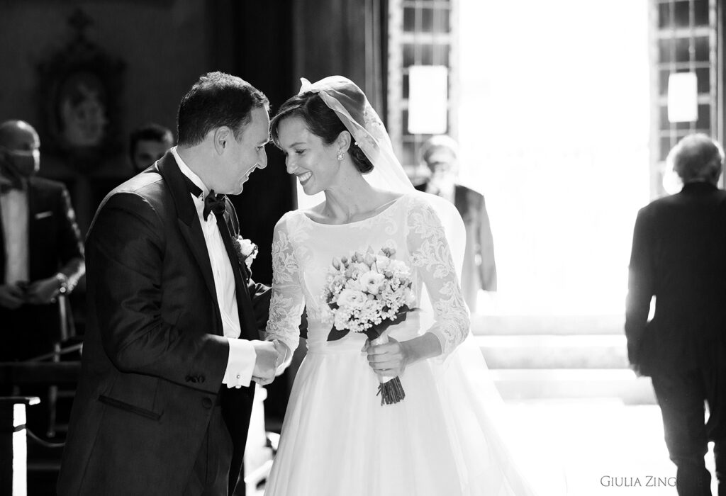 this is a picture of the bride and groom during the ceremony by villa del grumello wedding photographer at lake como giulia zingone