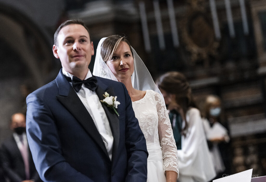 this is a picture of the bride and groom during the ceremony by villa del grumello wedding photographer at lake como giulia zingone