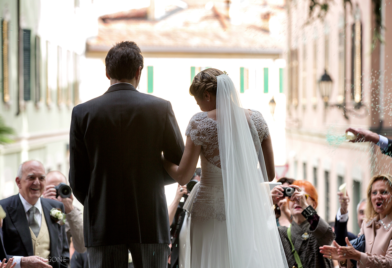 this picture is a candid shot from the church ceremony by villa erba cernobbio wedding photographer in lake como giulia zingone