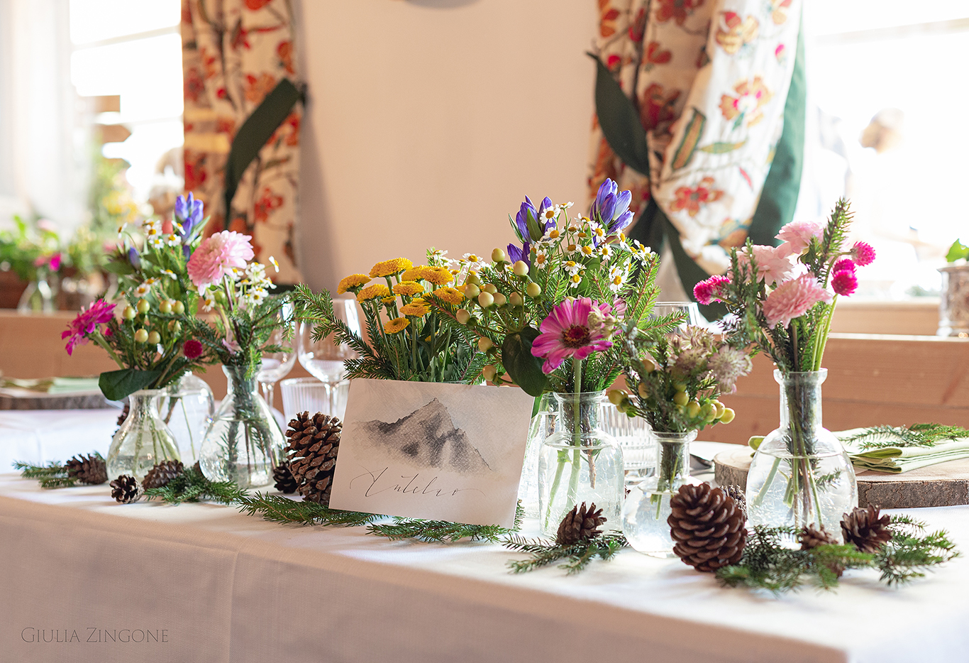 this is a picture of the table decor in the dolomites mountains by cortina wedding photographer giulia zingone
